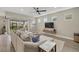 Open-concept living room with access to the lanai and kitchen at 3314 Chestertown Loop, Bradenton, FL 34211