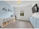 Playroom with built-in shelving and light blue accent wall at 3314 Chestertown Loop, Bradenton, FL 34211