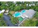 Aerial view of community pool, clubhouse, and parking at 3333 26Th E Ave # 1120, Bradenton, FL 34208