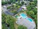 Aerial view showing community pool, tennis courts, and clubhouse at 3333 26Th E Ave # 1120, Bradenton, FL 34208