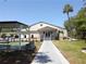 Community clubhouse with walkway and bocce ball courts at 3333 26Th E Ave # 1120, Bradenton, FL 34208