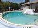 Kidney-shaped community pool with adjacent spa at 3333 26Th E Ave # 1120, Bradenton, FL 34208