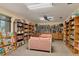 Community library with bookshelves and seating at 3443 Tallywood Cir # 7061, Sarasota, FL 34237