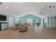 Spacious community room with light wood floors at 3443 Tallywood Cir # 7061, Sarasota, FL 34237