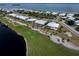 Aerial view showing home's location on golf course near water at 3455 Byron Ln, Longboat Key, FL 34228