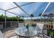 Screened patio with seating area, overlooking a golf course at 3455 Byron Ln, Longboat Key, FL 34228