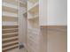 Large walk-in closet with ample shelving and hanging space at 3455 Byron Ln, Longboat Key, FL 34228