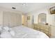 King-size bed, dresser, and ample closet space at 3709 Miguel Way # 8602, Sarasota, FL 34232