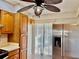 Kitchen features wood cabinets, stainless steel refrigerator, and access to patio at 4127 3Rd Ave W, Palmetto, FL 34221