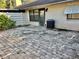 Back patio with pavers and exterior door at 4127 3Rd Ave W, Palmetto, FL 34221