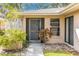 Condo front entrance with gray door and security screen at 4212 Center Gate Ln # 2, Sarasota, FL 34233