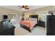 Main bedroom with king-size bed and private access to bathroom at 433 Scarlet Sage, Punta Gorda, FL 33955