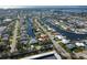 Aerial view of canal-front home with private dock and boat at 4419 Mangrove Point Rd, Bradenton, FL 34210