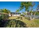 Private backyard with grassy area and white fence at 4419 Mangrove Point Rd, Bradenton, FL 34210