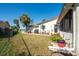 Spacious backyard with patio, grill, and lush landscaping at 4419 Mangrove Point Rd, Bradenton, FL 34210