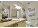 Updated bathroom with walk-in shower and grab bars at 4419 Mangrove Point Rd, Bradenton, FL 34210