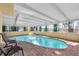 Inviting kidney-shaped pool with brick pavers and covered patio at 4419 Mangrove Point Rd, Bradenton, FL 34210