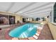 Inviting kidney-shaped pool with covered patio at 4419 Mangrove Point Rd, Bradenton, FL 34210