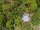 Bird's-eye view of house surrounded by trees at 4485 17Th W St, Bradenton, FL 34207