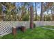 Brick grill and spacious backyard with a white picket fence at 4485 17Th W St, Bradenton, FL 34207