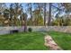 Backyard with grassy area and brick grill at 4485 17Th W St, Bradenton, FL 34207