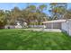 Large backyard with covered patio and grassy area at 4485 17Th W St, Bradenton, FL 34207