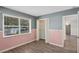 Bedroom with pink and grey walls and wood flooring at 4485 17Th W St, Bradenton, FL 34207