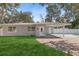House exterior featuring a carport and lawn at 4485 17Th W St, Bradenton, FL 34207