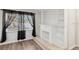 White brick fireplace with built-in shelving at 4485 17Th W St, Bradenton, FL 34207