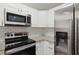 Modern kitchen features stainless steel appliances and granite countertops at 4485 17Th W St, Bradenton, FL 34207
