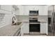 Modern kitchen with white cabinets and granite countertops at 4485 17Th W St, Bradenton, FL 34207