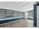 Sunroom with multiple windows and wood-look floors at 4485 17Th W St, Bradenton, FL 34207