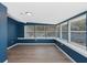 Bright sunroom with multiple windows and wood-look floors at 4485 17Th W St, Bradenton, FL 34207