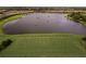 Aerial view of upscale community with lake and golf course at 4745 Benito Ct, Lakewood Ranch, FL 34211