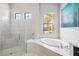 Spa-like bathroom featuring a soaking tub and walk-in shower at 4745 Benito Ct, Lakewood Ranch, FL 34211