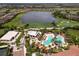 Community pool with lounge chairs and surrounding landscaping at 4745 Benito Ct, Lakewood Ranch, FL 34211