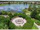 Relaxing fire pit area with seating near lake at 4745 Benito Ct, Lakewood Ranch, FL 34211