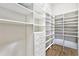 Large walk-in closet with ample shelving and drawers for storage at 4745 Benito Ct, Lakewood Ranch, FL 34211