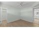 Bedroom with wood-look floors and access to bathroom and closet at 4775 Cove Cir # 202, St Petersburg, FL 33708