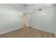 Bright bedroom with wood-look floors and ceiling fan at 4775 Cove Cir # 202, St Petersburg, FL 33708