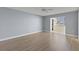 Spacious bedroom with laminate flooring and access to balcony at 4775 Cove Cir # 202, St Petersburg, FL 33708