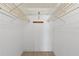 Walk-in closet with wire shelving at 4775 Cove Cir # 202, St Petersburg, FL 33708