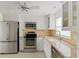 Updated kitchen with stainless steel appliances and granite counters at 4775 Cove Cir # 202, St Petersburg, FL 33708