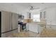 Bright kitchen with stainless steel appliances and granite countertops at 4775 Cove Cir # 202, St Petersburg, FL 33708