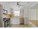 Updated kitchen, featuring stainless steel appliances and granite countertops at 4775 Cove Cir # 202, St Petersburg, FL 33708