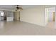 Open living room with kitchen access and tile floors at 4775 Cove Cir # 202, St Petersburg, FL 33708