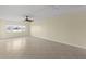 Spacious living room with tile floors and water views at 4775 Cove Cir # 202, St Petersburg, FL 33708