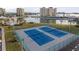 Two well-maintained tennis courts with surrounding fencing at 4775 Cove Cir # 202, St Petersburg, FL 33708