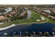 Panoramic aerial view of a lakeside golf course and luxury homes in a well-planned community at 505 Sand Crane Ct, Bradenton, FL 34212
