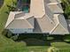 Aerial view displaying the tile roof, lush lawns, screened pool, and landscaping at 505 Sand Crane Ct, Bradenton, FL 34212